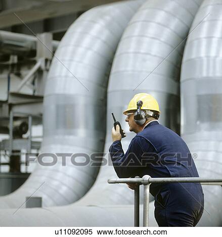 Stock Photography - Worker in a power station. Fotosearch