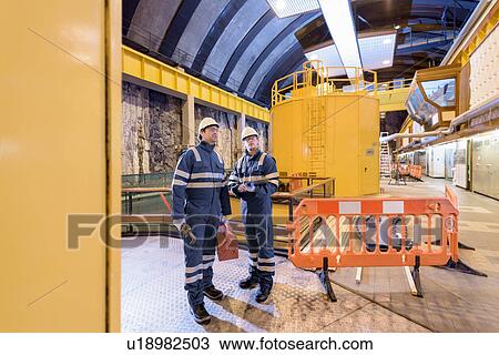 Workers in generating hall in hydroelectric power station View Large Photo Image Stock Image - Workers in generating hall in hydroelectric power station. Fotosearch