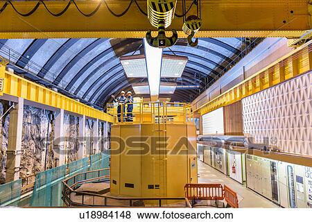 Stock Photo - Workers in generating hall in hydroelectric power station. Fotosearch