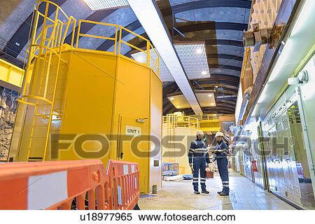 Workers in generating hall in hydroelectric power station View Large Photo Image Stock Photography - Workers in generating hall in hydroelectric power station. Fotosearch
