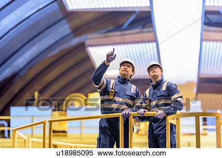 Workers in generating hall in hydroelectric power station View Large Photo Image Stock Photography - Workers in generating hall in hydroelectric power station. Fotosearch