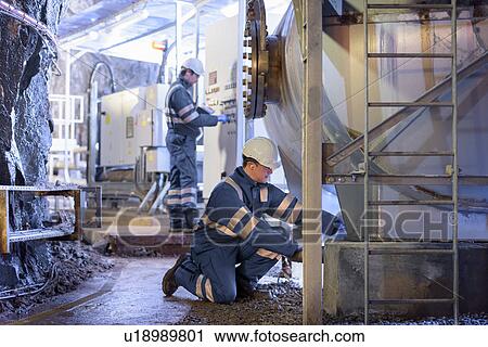 Workers with machinery in hydroelectric power station View Large Photo Image Stock Image - Workers with machinery in hydroelectric power station. Fotosearch