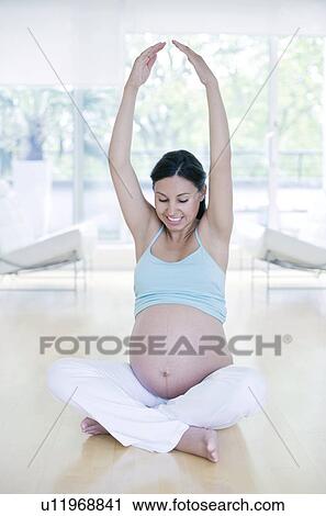 Stock Image - Yoga in pregnancy. Fotosearch