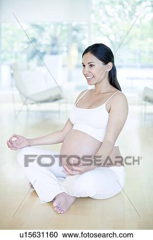 Stock Image - Yoga in pregnancy. Fotosearch