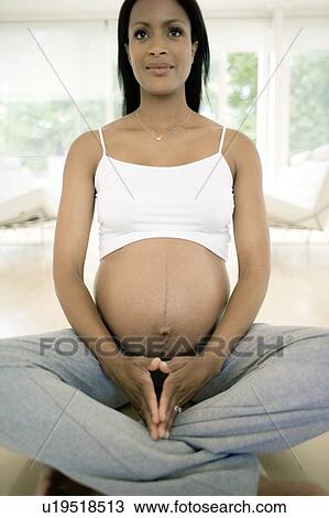 Stock Image - Yoga in pregnancy. Fotosearch