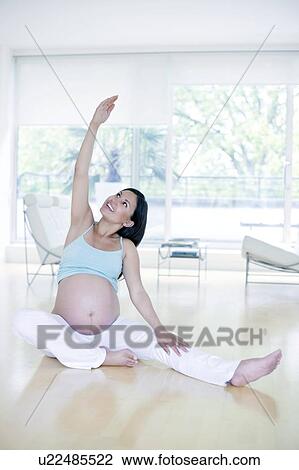 Stock Image - Yoga in pregnancy. Fotosearch
