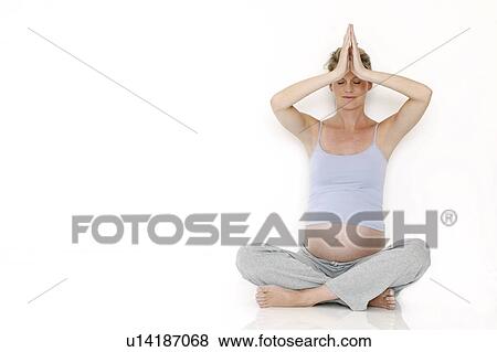 Stock Photo - Yoga in pregnancy. Fotosearch