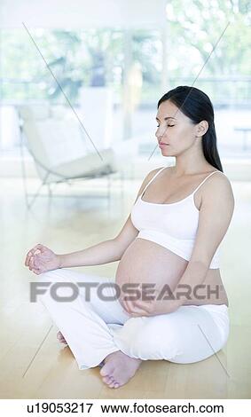 Stock Photo - Yoga in pregnancy. Fotosearch