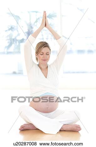 Stock Photo - Yoga in pregnancy. Fotosearch