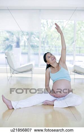 Stock Photo - Yoga in pregnancy. Fotosearch