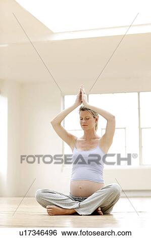 Stock Photograph - Yoga in pregnancy. Fotosearch