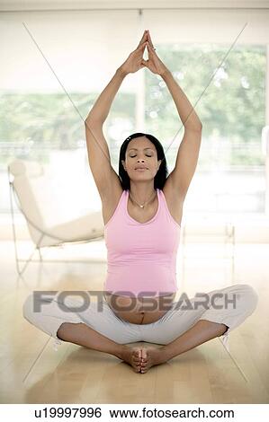 Stock Photograph - Yoga in pregnancy. Fotosearch