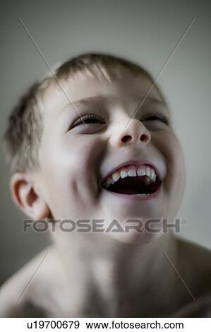 Stock Photo - Yong boy laughing. Fotosearch