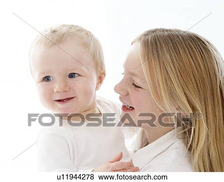 Stock Photo - Young girl and baby. Fotosearch