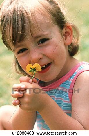 Young girl with a flower View Large Photo Image Stock Photo - Young girl with a flower. Fotosearch
