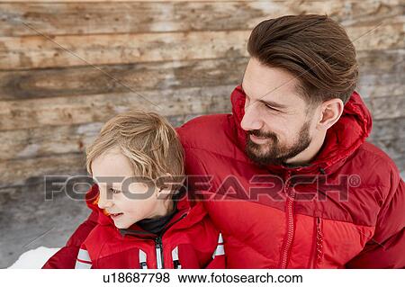 Young man and son at cabin in snow, Elmau, Bavaria, Germany View Large Photo Image Stock Photo - Young man and son at cabin in snow, Elmau, Bavaria, Germany. Fotosearch