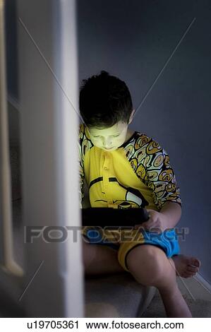 Young using handheld device View Large Photo Image Stock Image - Young using handheld device. Fotosearch