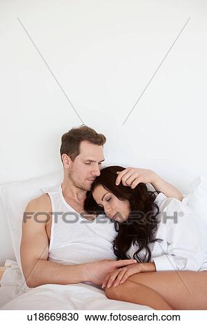 Young woman asleep on boyfriends shoulder in bed View Large Photo Image Stock Image - Young woman asleep on boyfriends shoulder in bed. Fotosearch