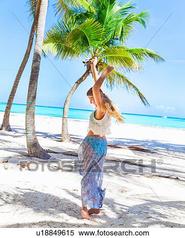 Young woman dancing on beach, Dominican Republic, The Caribbean View Large Photo Image Stock Photography - Young woman dancing on beach, Dominican Republic, The Caribbean. Fotosearch