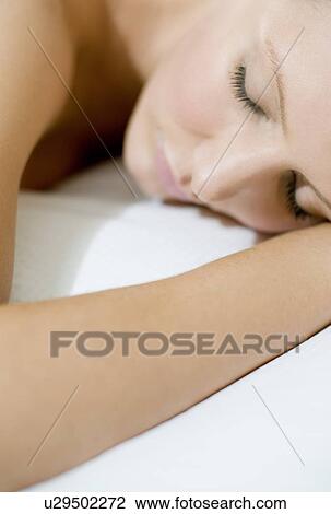 Young woman sleeping View Large Photo Image Stock Image - Young woman sleeping. Fotosearch