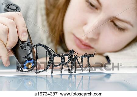 Stock Photo - Young woman using 3D printing pen. Fotosearch