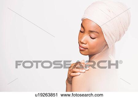 Young woman wearing headscarf, hand on shoulder View Large Photo Image Stock Image - Young woman wearing headscarf, hand on shoulder. Fotosearch