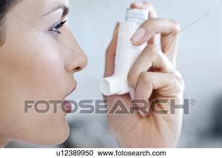 Asthma inhaler use View Large Photo Image Stock Image - Asthma inhaler use. Fotosearch