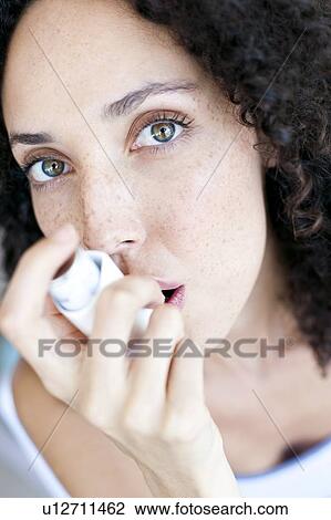 Asthma inhaler use View Large Photo Image Stock Image - Asthma inhaler use. Fotosearch