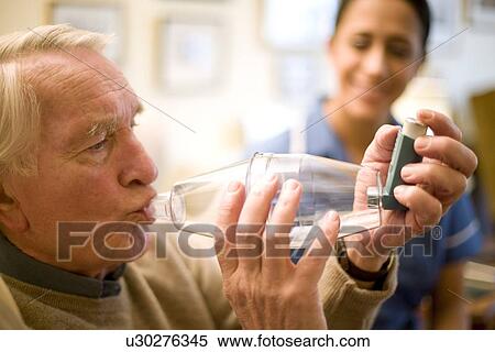 Stock Photography - Asthma spacer use. Fotosearch