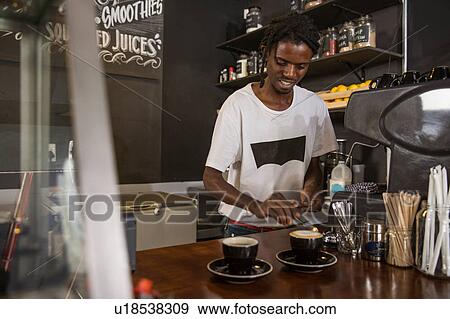 Stock Photo - Barista preparing coffee. Fotosearch