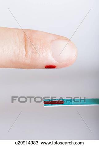 Stock Image - Blood glucose test. Fotosearch