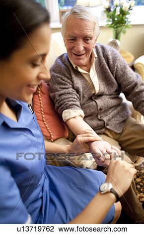 Stock Image - Checking pulse. Fotosearch