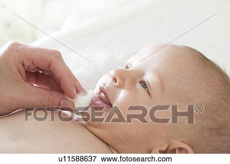 Stock Photo - Cleaning baby. Fotosearch
