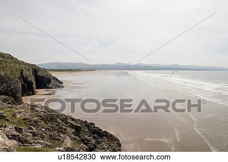 Cliffs and beach, Porthmadog, Wales, UK View Large Photo Image Stock Image - Cliffs and beach, Porthmadog, Wales, UK. Fotosearch