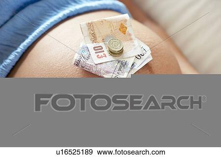 Stock Photo - Cost of pregnancy. Fotosearch