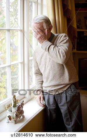 Stock Image - Depressed senior man. Fotosearch
