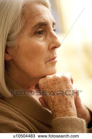 Stock Image - Depressed senior woman. Fotosearch