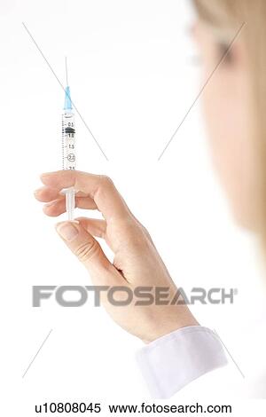 Stock Photography - Doctor with syringe. Fotosearch