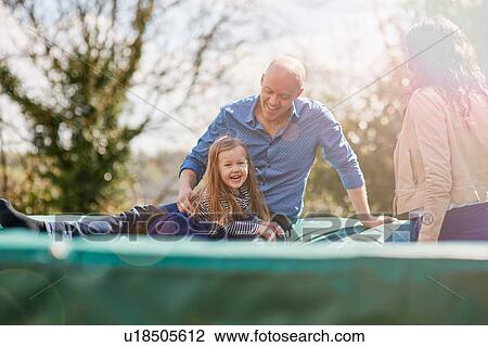 Family sitting on trampoline View Large Photo Image Stock Image - Family sitting on trampoline. Fotosearch