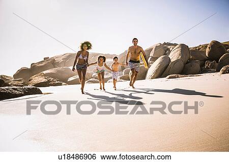 Family with two children running on beach, Cape Town, South Africa View Large Photo Image Stock Photograph - Family with two children running on beach, Cape Town, South Africa. Fotosearch