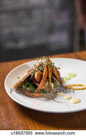 Gourmet food on plate on table View Large Photo Image Stock Photography - Gourmet food on plate on table. Fotosearch