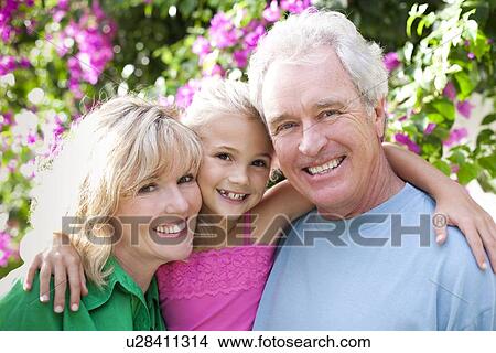 Picture - Grandparents and granddaughter. Fotosearch