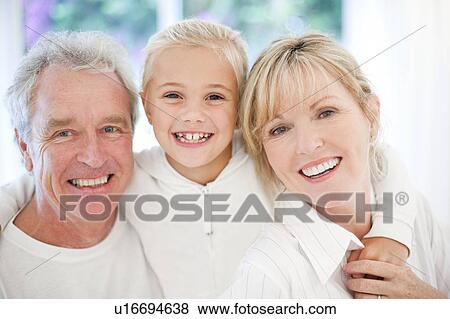 Stock Photo - Grandparents and granddaughter. Fotosearch