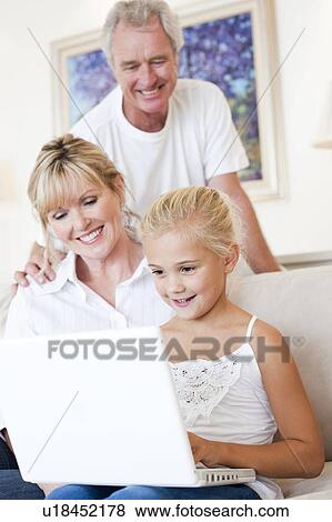 Stock Photo - Grandparents and granddaughter. Fotosearch