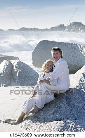 Stock Photo - Happy couple on a beach. Fotosearch