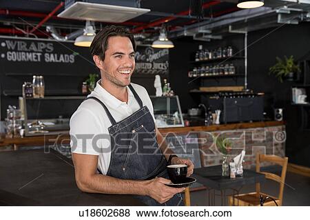Happy restaurateur taking coffee break View Large Photo Image Stock Photo - Happy restaurateur taking coffee break. Fotosearch