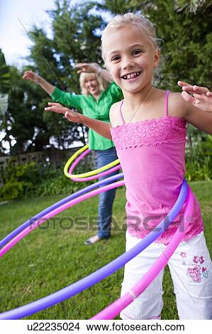 Picture - Hula-hooping. Fotosearch