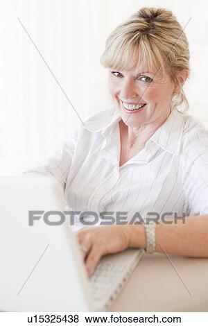 Stock Photo - Laptop use. Fotosearch