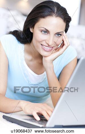 Stock Photo - Laptop use. Fotosearch