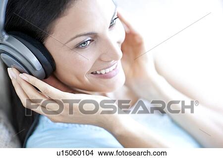 Picture - Listening to music. Fotosearch